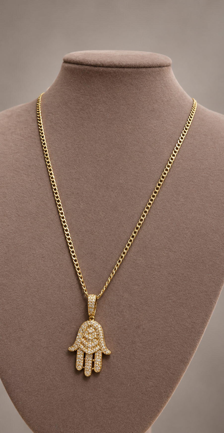 Gold chain with a stone-set hamsa pendant